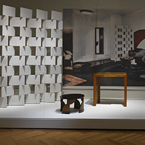 Exhibition image of Gray's block screen and two tables.
