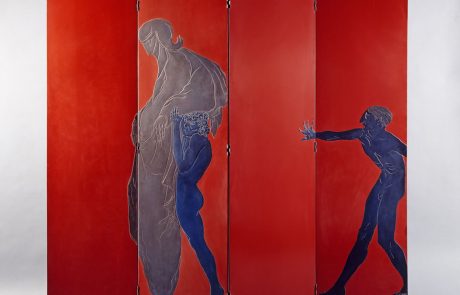 Installation image of a red lacquered wood screen with two blue nude male figures and a third figure in silver all depicted in an ancient Greek style.