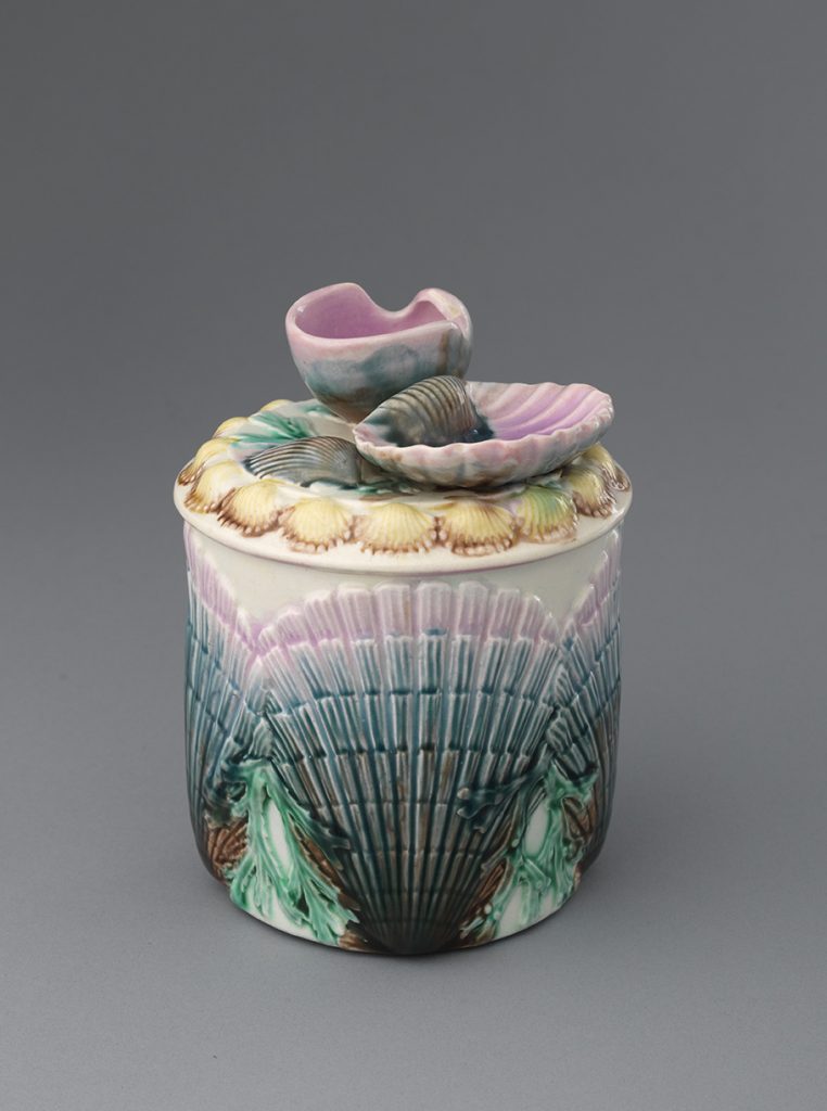 Majolica green and pink shell motif cigar box with shell finial on lid.