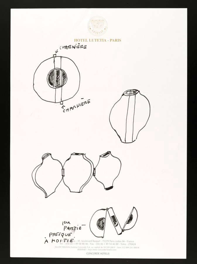 A piece of paper with "Hotel Lutetia Paris" letterhead at the top. It contains hand-drawn sketches of an object resembling a segmented, possibly hinged, decorative item or container with French labels indicating parts and notes.