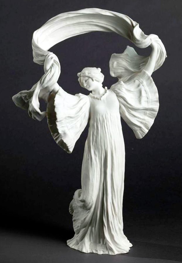 A graceful white porcelain sculpture depicts a person with flowing robes, elegantly holding a scarf above their head. The delicate folds and textured details create a sense of movement, set against a dark background.