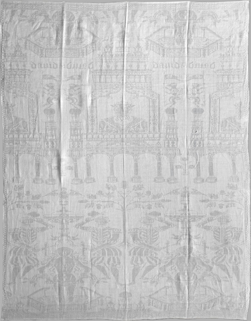 A white linen napkin depicting the story of David and Bathsheba. The symmetrical design features the text "David" above a man with a crown looking out of a window. Below, two figures approach a woman bathing in a hexagonal fountain.
