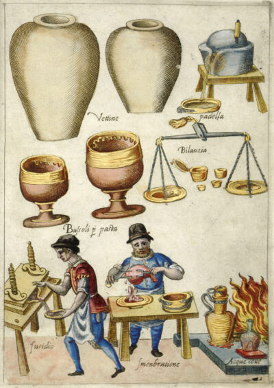 A colored Illustration depicting various kitchen vessels at the top and two men performing tasks below. One figure is carving an animal carcass with a fork and knife, slicing the meat into a dish, and the other catches a liquid in a dish running off of a table. Both men stand next to several vessels placed in a wood burning fire. Text in Italian labels the items and activities.