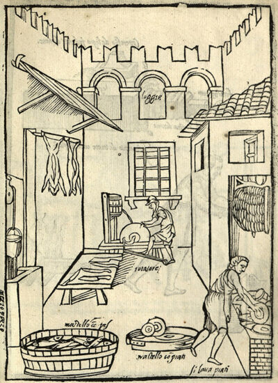 Illustration depicting an exterior kitchen space with two workers. One is sharpening knives on a stone wheel in the background while the other stands washing dishes. A well, hanging animal carcasses, and a large basin filled with fish are also visible.